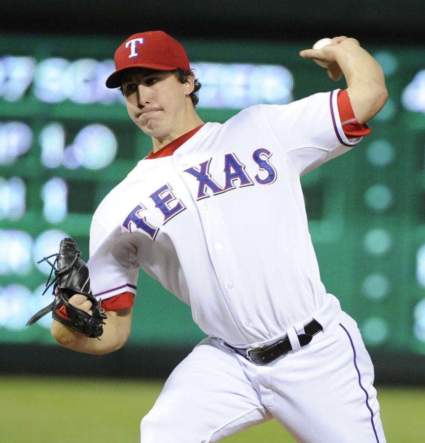 Texas Rangers starter Derek Holland (45) pitches against the Detroit Tigers during Game 6 of the American League Championship Series in Arlington, Texas, Saturday, October 15, 2011. (Max Faulkner/Fort Worth Star-Telegram/MCT)