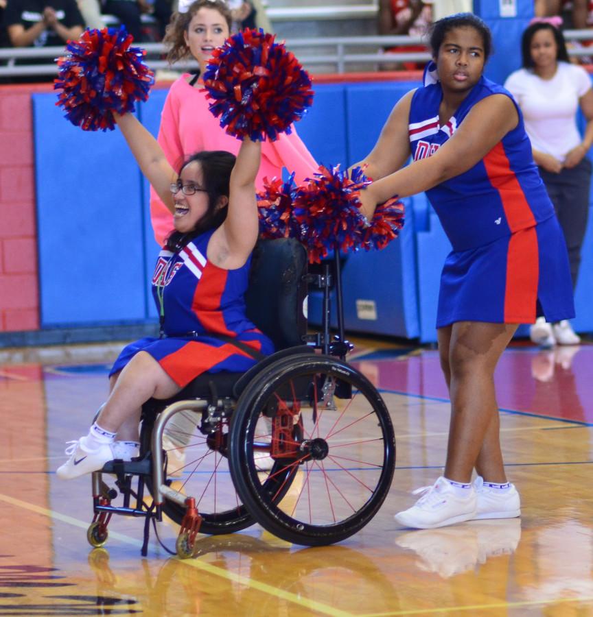 Senior Sparklers Cheer captain Genesis Montanez pumps up the crowd as she chants "DHS the Best" at a recent pep rally in Sandra Meadows Arena.  The tem is one of five in the state. (Ciara Thibodaux photo)