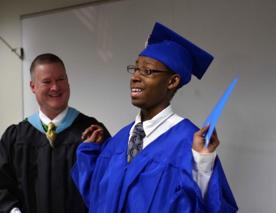 Deuntae Pegues gives a shout out to all those who helped him obtain his diploma from Duncanville.  He moved to PACE learning center after being diagnosed with a brain tumor that affected his motor skills. He recently graduated with his classmates from PACE. (Xavier Goode photo)