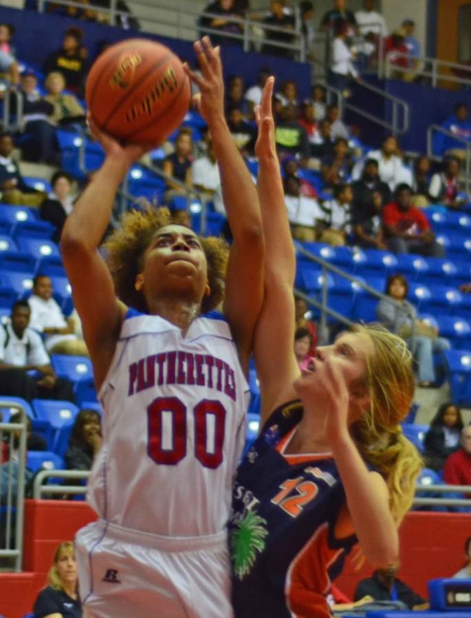 Senior Kiara Perry takes the ball to the basket against a visiting Austrailian team. (Abigail Padgett photo)