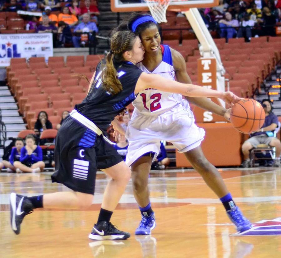 Junior Ariel Atkins collides with a Clear Springs defender as she looks for the steal in the third period of play in their 64-40 win. (Olivia Davila photo)