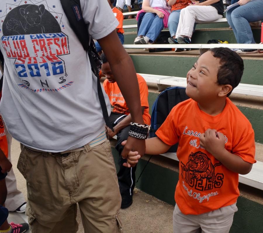 Club Fresh students walked hand in hand with special needs students during the Special Olympics district meet. (Karla Estrada photo)