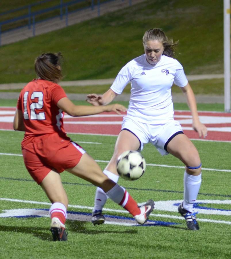 Senior Hannah Henton fights for the ball against Belton in the first round of the playoffs. The team will now face Hebron. (Lisette Lopez photo)