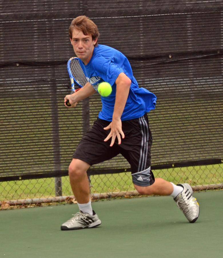 Sophomore Gavin Beach prepares to hit a forehand during the district finals