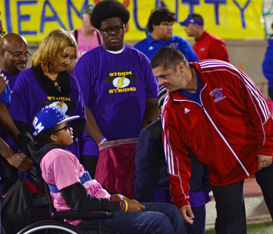 Malone makes monumental return to Panther Stadium after domestic violence attack