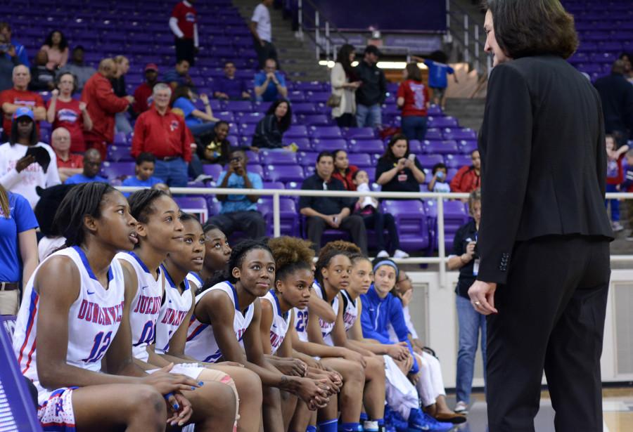 Pantherette head coach Cathy Self-Morgan shares a winning moment with her seniors on the bench at the end of their 70-29 blowout over LD Bell in the Region 1 Finals game. (Olivia Davila photo)