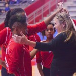 Coach Lyn Evans holds a pep talk with the junior varsity team during a timeout in the Midlothian game. (photo by Alicia Nichols)