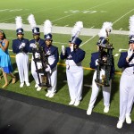 Drum Majors and high hat captains proudly accept their tropes at the close of the Plano Marching contest. (Karla Estrada Photo)