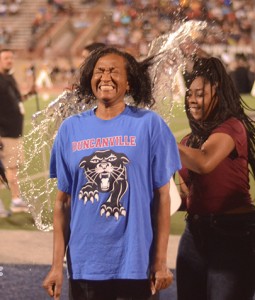 Teachers from the high school along with some administration staff joined each other on the field while students doused them with ice water in an effort to raise money for ALS. (Olivia Colchado photo)