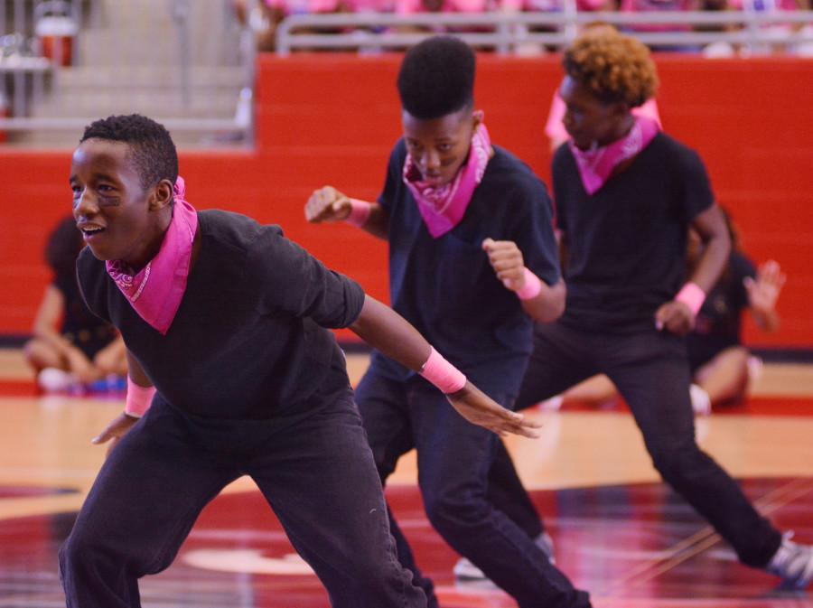 The step team opens up for  the Cedar Hill pep rally. The team started up this year and has become a regular performance group at school events. (Karla Estrada photo)