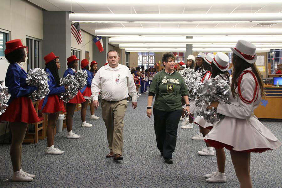 This was the third annual veterans day luncheon. The choir, high hats, sparklers, and cheerleaders were present to show their appreciation. Here, two veterans are welcome with applause. (Photo By: Cynthia Rangel)