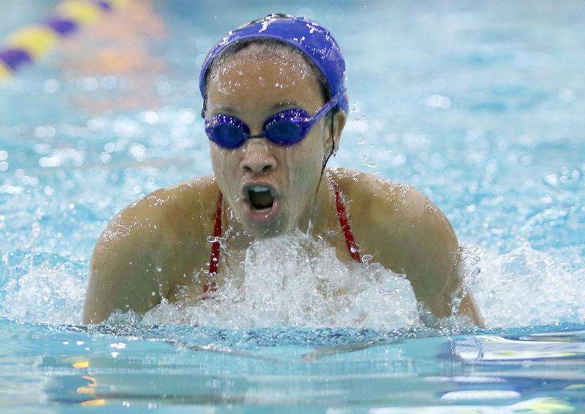 Junior Randi Ford comes up  for air during her relay event at district. (Olivia Colchado photo)