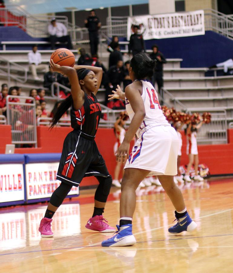 Rosie Davis guards a South Grand Prairie Warrior in their matchup. (Photo by: Kyhia Jackson)