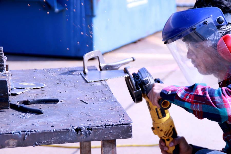 Welding students work on projects