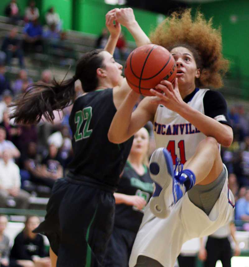 Senior Madison Townley presses past a Southlake defender during their Bi-District matchup. (Karla Estrada Photo)