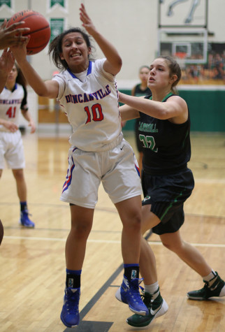 Junior Nina Alvarez pulls the ball down during the Southlake game. (Karla Estrada photo)