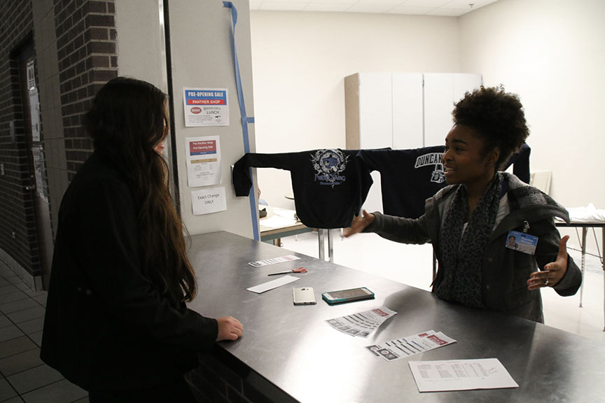 Senior marketing student Joycelyn Stewart interacts with a potential customer. (Photo by: Melissa Retina)