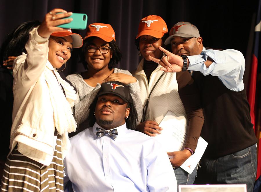 Marcel Southall, one of the nations most sought after Defensive Tackles decides on the University of Texas for his future as a football player. He and his family take a selfie after his decision is revealed. (Cynthia Rangel photo)