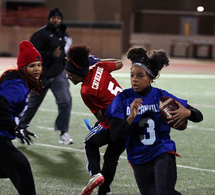 Senior QB Lauren Laurent  attempts to run the ball in for the game-winning touchdown before a flag is thrown for holding elsewhere on the field. (Photo by: Ricardo Martin)