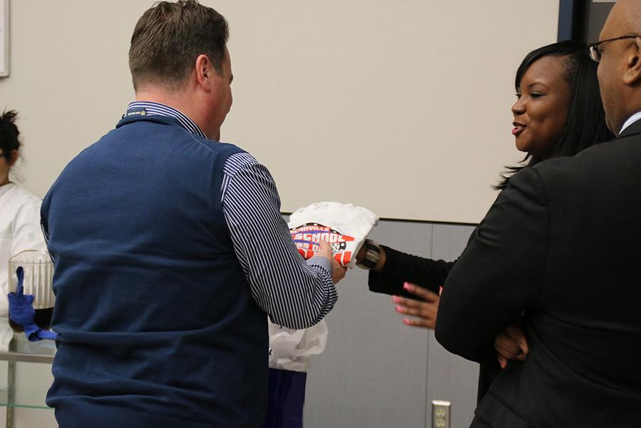 DHS Career and Technical Education Director Shalontae Payne presents Monasterolo, Italy's mayor Marco CavaggliaItaly  a Duncanville shirt created by  the CTE department. (photo by: Ricardo Martin)