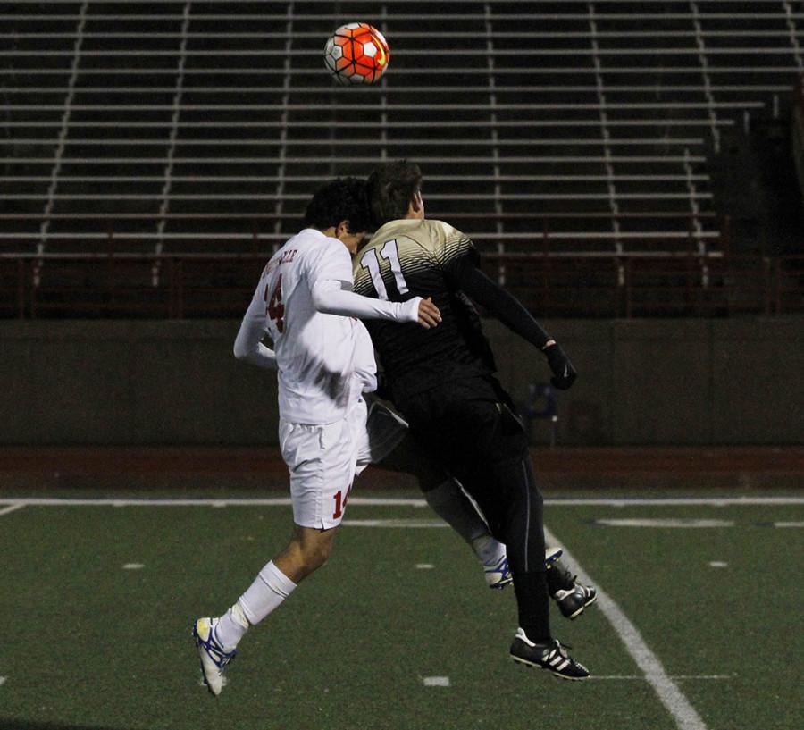 Varsity soccer boys play against Mansfield