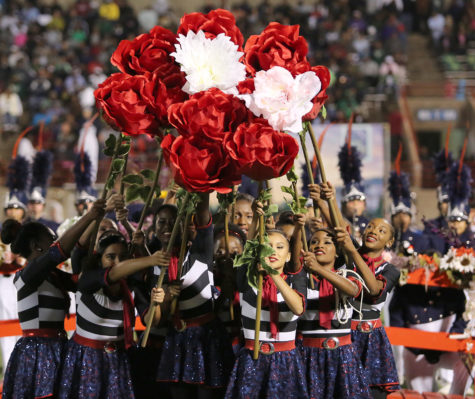 High Hats ad to the color of the show with their dancing routines  moving within the marching and music. (Ricardo martin photo)