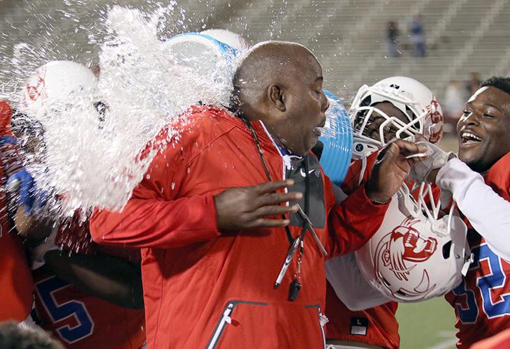 Panther Head Coach Reginald Samples takes a shower at the hands of this team after Duncanville's first round playoff win. (Jose Sanchez photo)