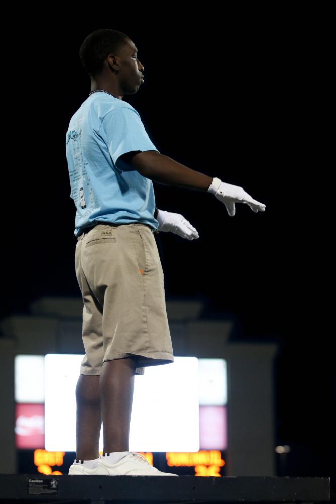 Drum Major, Jeremiah Dukes, conducts band at first game