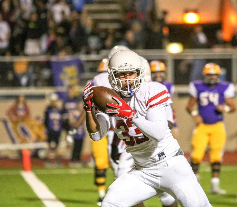 Senior Anthony Cruz scores after intercepting the pass in the third quarter.