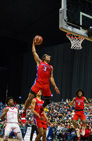 Jahmius Ramsey (3) goes up for the slam vs North Shore in the UIL state semi final.