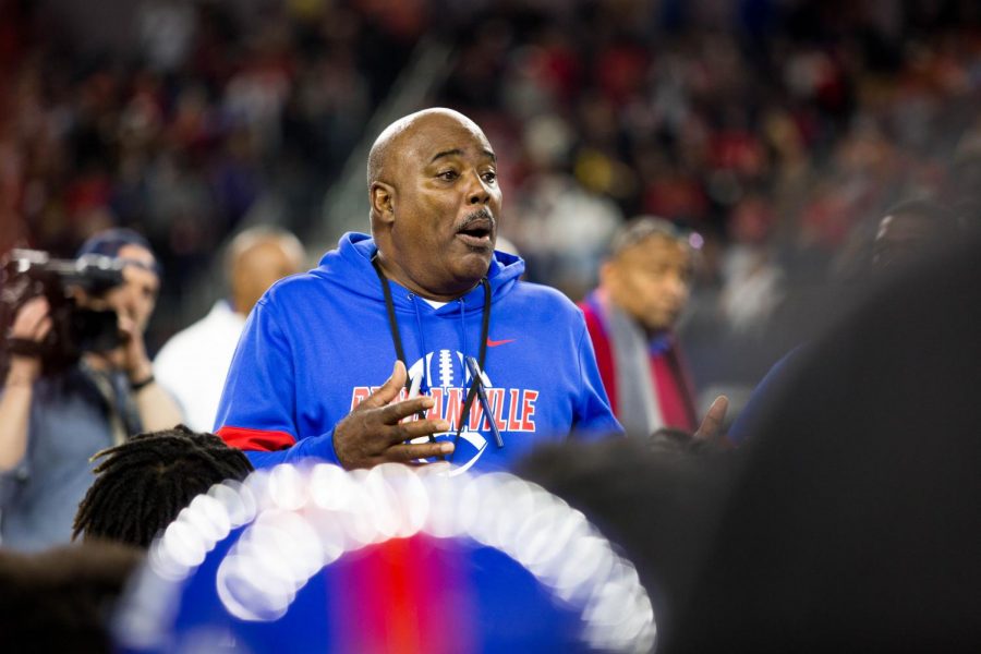 Coach Samples addresses the team after a loss in the UIL state championship. 