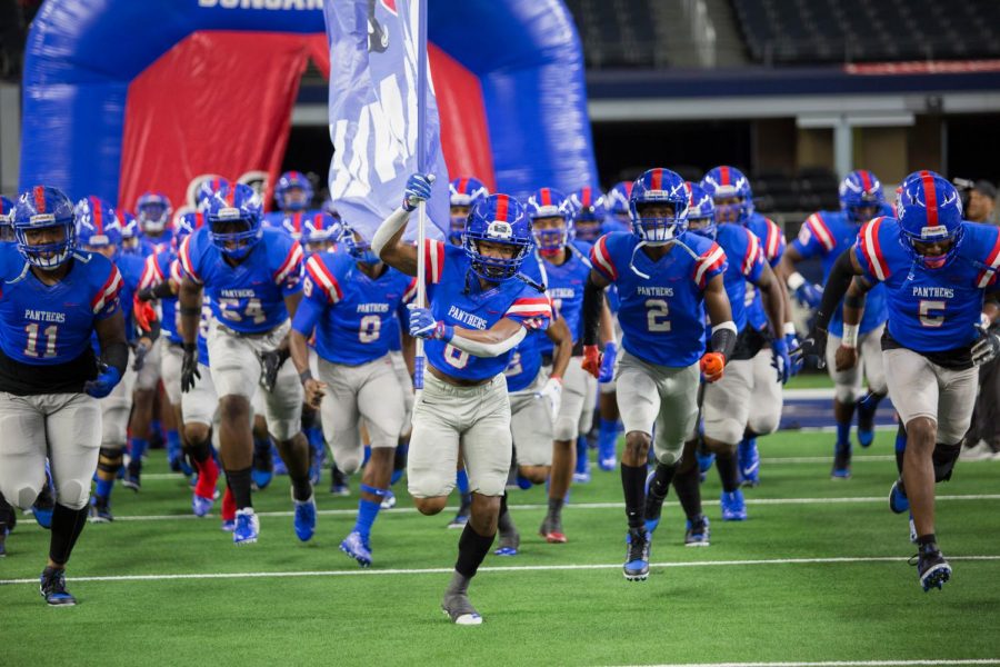 Duncanville Football team Running out for game against Flower Mound