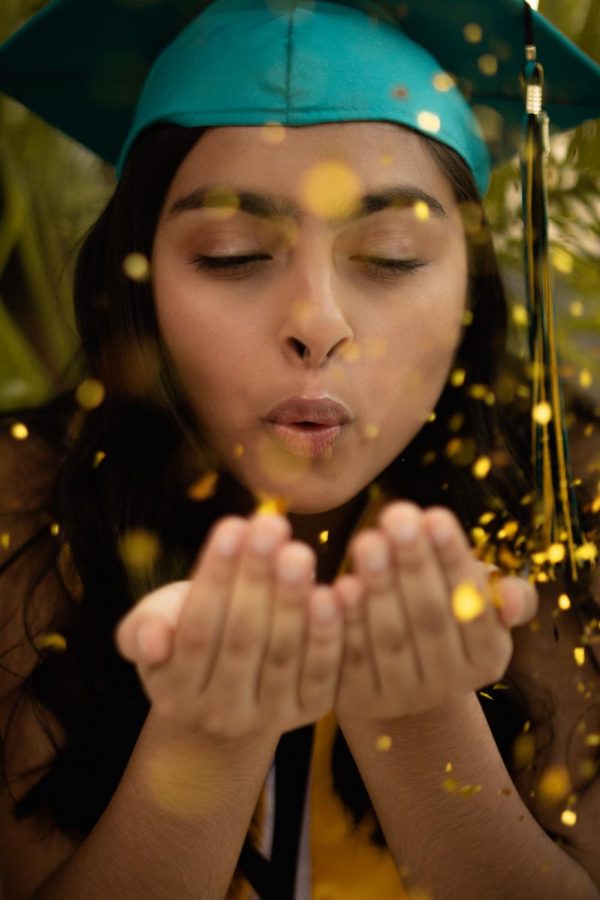 Melissa Lopez posing for her 2019 senior photos at the Lakeside Park in Highland Park, Tx.