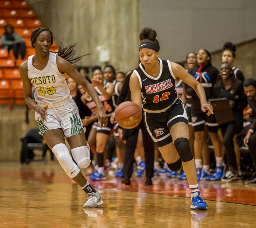 Zaria Rufus dribbles up the court against Desoto.