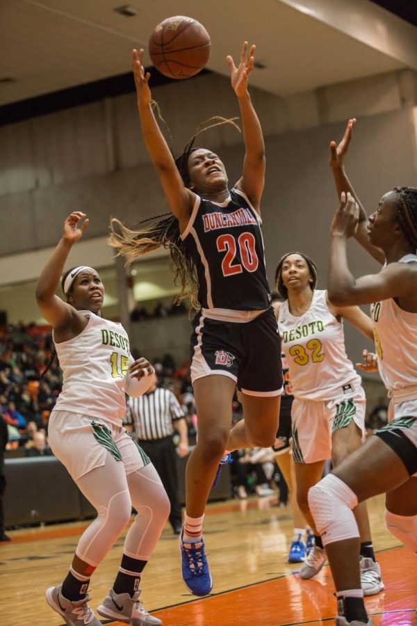 Anaya Benard goes up for the rebound against Desoto.