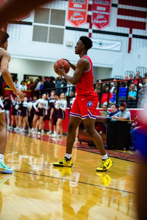 Damon Nichols looks for a teammate to pass the ball to.