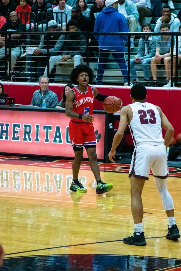 Ja'Bryant Hill brings the ball up the court.