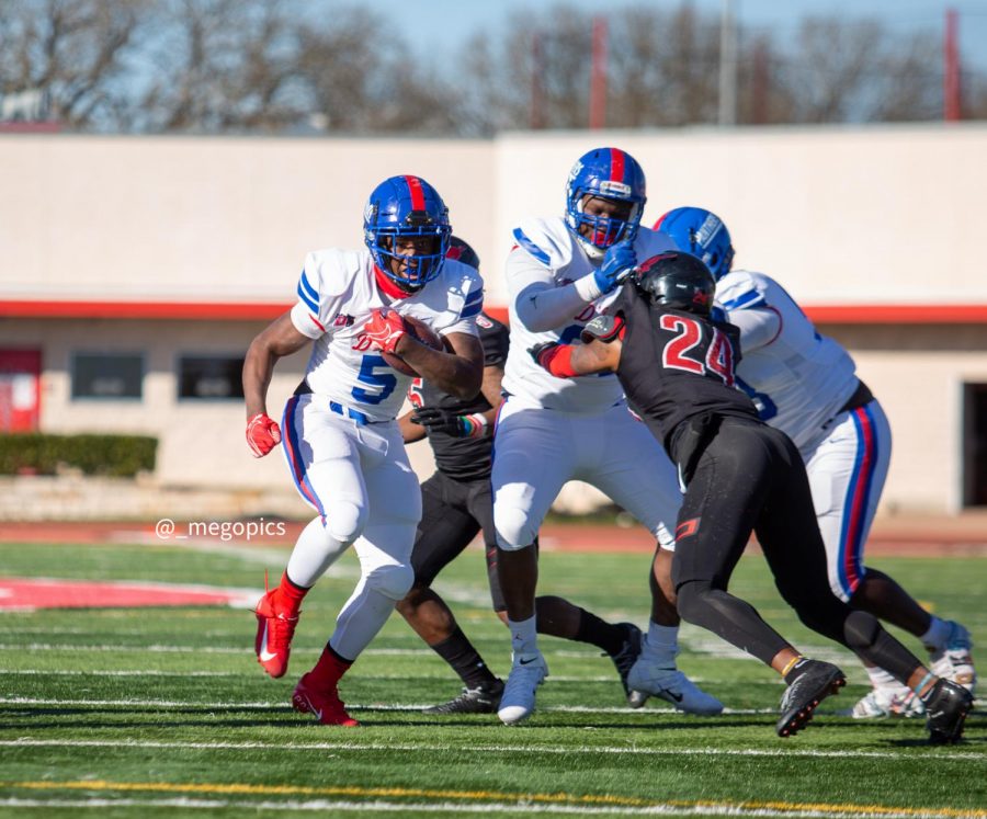 Malachi Medlock rushes past the Westfield defense.