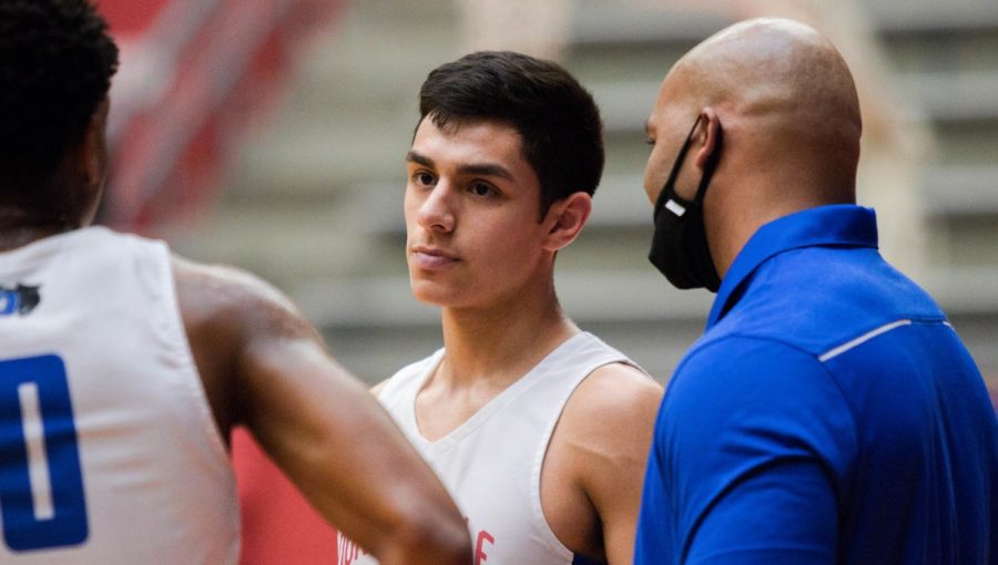 Coach Peavy talking to Juan Reyna.