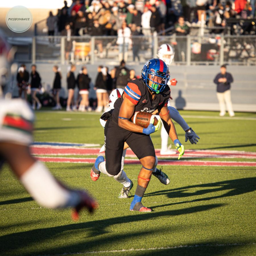 Vernon Grant intercepts the ball vs the Woodlands during the 3rd quarter of a 3rd round playoff game in Pfluegerville, TX.