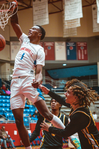 Ron holland slams against Brennan at home in the season opener.