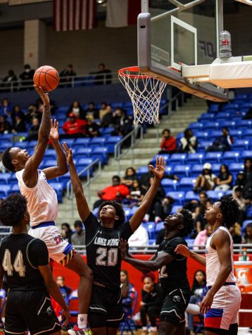 Ron holland (1) goes up. against lake ridge.