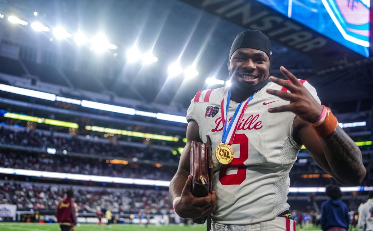 (8) Colin Simmons celebrates being named Defensive MVP in the state championship game. 