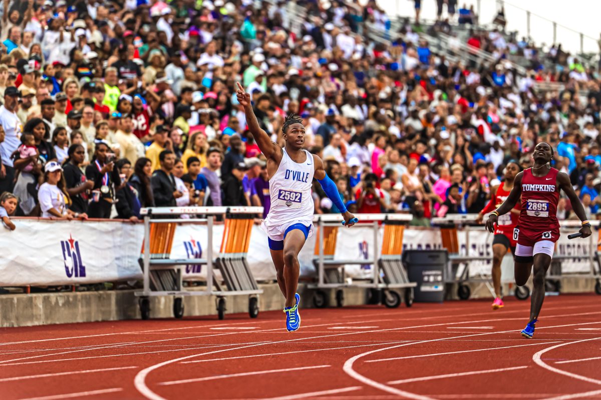 Junior Dakorien Moore crosses the line as Duncanville broke the national record in the 4 x 200 meter relay at the boys 6A state track meet. 