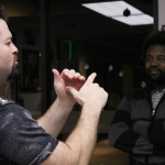 American Sign Language teacher Matthew Snelling speaks to a person in their language during a deaf chat event at Hav-R burgers in town. (Kennedy Stidham photo)