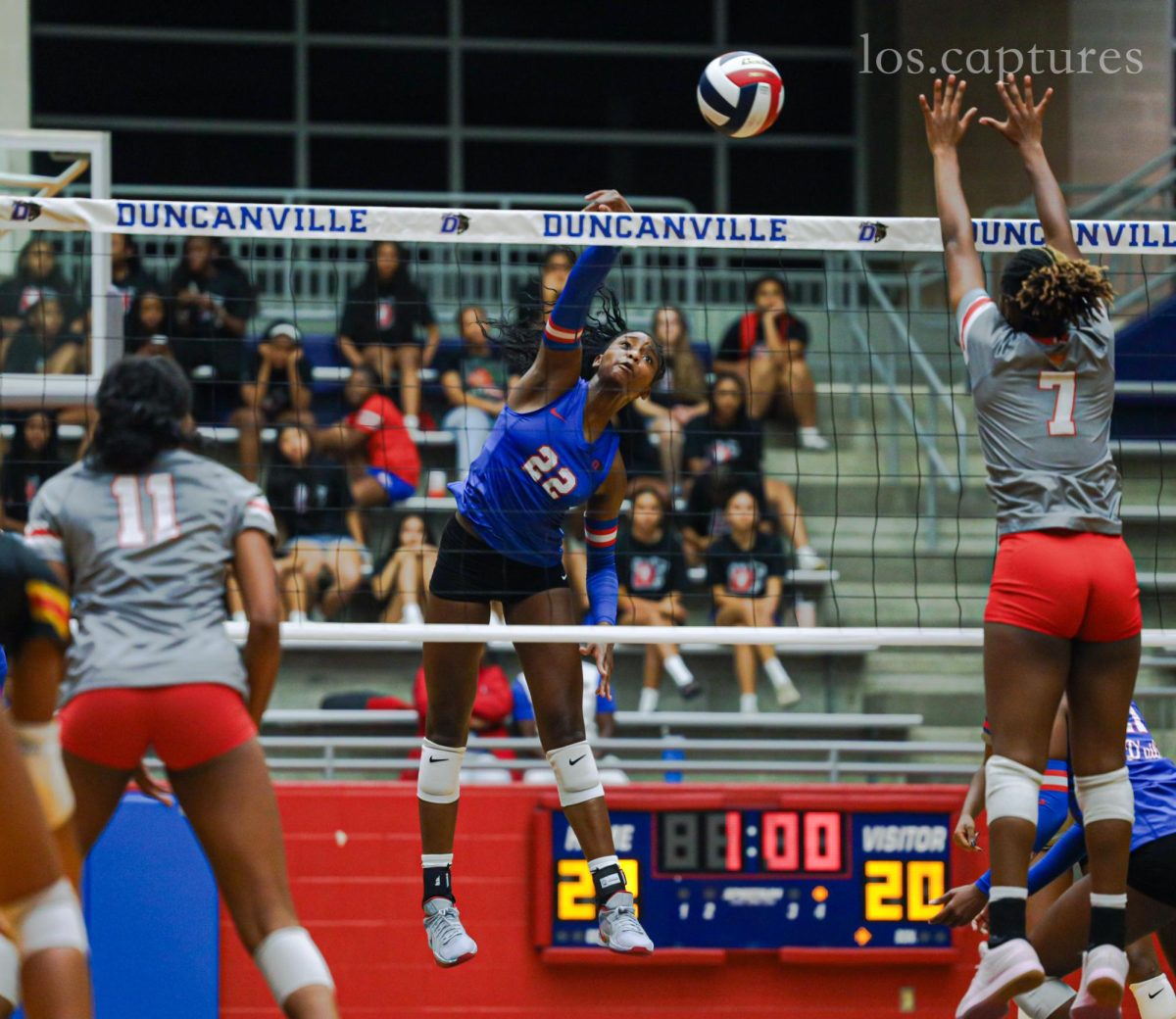 Freshman standout Payton Smith (22) spikes the ball during the match vs Cedar Hill at Sanda Meadows Arena.